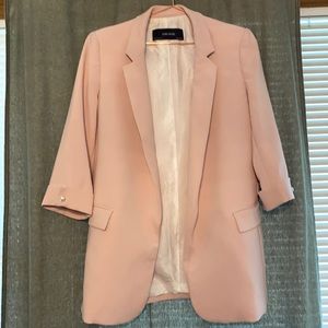 ZARA Woman’s suit coat in light pink.